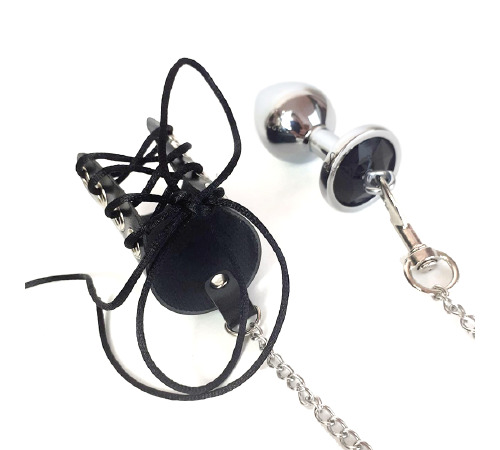 Металева анальна пробка для чоловіків з корсетом для пеніса